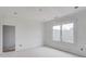 Bright bedroom with a large window, recessed lights, and awaiting customization, making it an ideal space for relaxation at 3203 Bold Springs Rd, Dacula, GA 30011