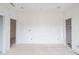 Spacious bedroom featuring multiple doorways, recessed lighting, and neutral walls, perfect for creating a personalized retreat at 3203 Bold Springs Rd, Dacula, GA 30011
