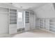 Spacious walk-in closet featuring built-in shelves and cabinets, still under construction at 3203 Bold Springs Rd, Dacula, GA 30011