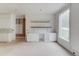The kitchen has a serving bar and custom cabinets with a large window offering views of the outdoors at 3203 Bold Springs Rd, Dacula, GA 30011
