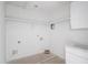Laundry room with shelf, white walls, and connections for appliances, ready for efficient organization and convenience at 3203 Bold Springs Rd, Dacula, GA 30011