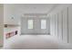 Spacious living room under construction with large windows and decorative ceilings and walls at 3203 Bold Springs Rd, Dacula, GA 30011