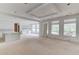 A bright, unfinished living room with large windows offering natural light at 3203 Bold Springs Rd, Dacula, GA 30011
