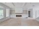Bright living room featuring a fireplace with custom built-ins and large windows for natural light at 3203 Bold Springs Rd, Dacula, GA 30011