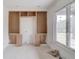 Room with built-in shelving, unfinished, and large window at 3203 Bold Springs Rd, Dacula, GA 30011
