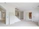 Large unfinished living area with staircase and multiple doorways at 3203 Bold Springs Rd, Dacula, GA 30011