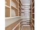 Walk-in pantry with custom shelving offers plenty of room for storage at 3203 Bold Springs Rd, Dacula, GA 30011