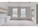 The room offers large windows for natural light and custom built-ins for storage and display at 3203 Bold Springs Rd, Dacula, GA 30011