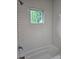 Bathroom showcasing white subway tile and a window above the tub and shower at 4075 Sw Fairburn Sw Ave, Atlanta, GA 30331