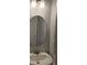 Stylish bathroom with pedestal sink and oval mirror at 4075 Sw Fairburn Sw Ave, Atlanta, GA 30331
