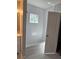 Bright bathroom featuring a tiled shower-tub combo and hexagon tile flooring at 4075 Sw Fairburn Sw Ave, Atlanta, GA 30331