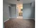Carpeted bedroom with view to a full bathroom, showing an en-suite option or adjacent facilities at 4075 Sw Fairburn Sw Ave, Atlanta, GA 30331