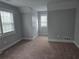Carpeted room bathed in natural light, showcasing a cozy and inviting space for relaxation at 4075 Sw Fairburn Sw Ave, Atlanta, GA 30331