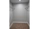 Walk-in closet with carpet, gray walls, and metal shelving racks for storage at 4075 Sw Fairburn Sw Ave, Atlanta, GA 30331
