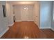 Open dining room features hardwood floors, neutral walls, and a classic chandelier, ready for personal touches at 4075 Sw Fairburn Sw Ave, Atlanta, GA 30331