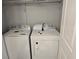 A laundry room with a white front load washer and dryer at 4075 Sw Fairburn Sw Ave, Atlanta, GA 30331
