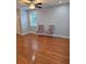 Cozy living room featuring hardwood floors, a ceiling fan, and stylish chairs by the window at 4075 Sw Fairburn Sw Ave, Atlanta, GA 30331