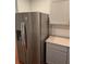 Spacious refrigerator with gray cabinets and granite countertops in the kitchen at 4075 Sw Fairburn Sw Ave, Atlanta, GA 30331