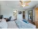 Bedroom featuring comfortable furnishings, a desk, and a ensuite at 6215 Barley Sq, Sugar Hill, GA 30518