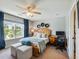 Bright bedroom featuring a ceiling fan, and a cozy decor at 6215 Barley Sq, Sugar Hill, GA 30518