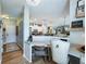 Interior view of home featuring a desk and an open concept view of the kitchen at 6215 Barley Sq, Sugar Hill, GA 30518