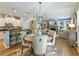 Open-concept living area seamlessly connects the kitchen, dining space, and living room, perfect for modern living at 6215 Barley Sq, Sugar Hill, GA 30518