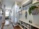 Hallway mudroom with storage shelving and decorated with oars and nautical decor at 6215 Barley Sq, Sugar Hill, GA 30518