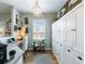 Bright office space with built in cabinets, desk, and natural light at 6215 Barley Sq, Sugar Hill, GA 30518
