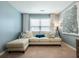 Charming sitting area with a plush sofa, accent pillows, and a large decorative art piece at 6215 Barley Sq, Sugar Hill, GA 30518