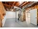 Unfinished basement with painted floor and exposed HVAC at 77 Township Drive, Hiram, GA 30141