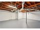 Large unfinished basement with painted floor and exposed HVAC at 77 Township Drive, Hiram, GA 30141