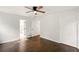 Bright bedroom featuring hardwood floors, neutral walls, and a ceiling fan for added comfort at 77 Township Drive, Hiram, GA 30141