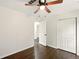 Cozy bedroom with hardwood floors, ceiling fan, and closet space at 77 Township Drive, Hiram, GA 30141