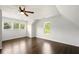 Spacious bedroom with hardwood floors, multiple windows, and an abundance of natural light at 77 Township Drive, Hiram, GA 30141