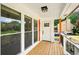 Inviting front porch with wood decking and views of the landscaped yard at 77 Township Drive, Hiram, GA 30141