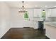 Eat-in kitchen with granite countertops, stainless steel appliances, and hardwood floors at 77 Township Drive, Hiram, GA 30141