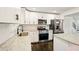 Modern kitchen with granite countertops, stainless steel appliances, and white cabinets at 77 Township Drive, Hiram, GA 30141