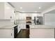 Kitchen with granite countertops, stainless steel appliances, and lots of natural light at 77 Township Drive, Hiram, GA 30141