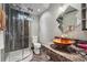 Modern bathroom featuring a glass shower with dark marble tile and a unique vessel sink at 2030 Spring End Ct, Lawrenceville, GA 30044