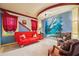 The bedroom features a red sofa bed and a custom mural of a shark on the wall at 2030 Spring End Ct, Lawrenceville, GA 30044
