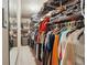 Walk-in closet with ample storage, including shelves and rods for clothing and personal items at 2030 Spring End Ct, Lawrenceville, GA 30044