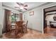 Cozy dining area featuring a wood table, chairs, and natural light from a large window at 2030 Spring End Ct, Lawrenceville, GA 30044