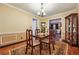 Dining room with wood floors, rug, chandelier, china cabinet and furniture set at 2030 Spring End Ct, Lawrenceville, GA 30044