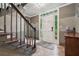Well-lit entryway with stairs and neutral colors at 2030 Spring End Ct, Lawrenceville, GA 30044