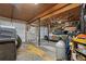 Functional garage space with ample storage and a vehicle under repair at 2030 Spring End Ct, Lawrenceville, GA 30044