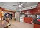Spacious kitchen with red cabinets, stainless steel appliances, and open layout to living area at 2030 Spring End Ct, Lawrenceville, GA 30044