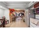 Open kitchen featuring red cabinets, stainless steel appliances and connected living area with mural at 2030 Spring End Ct, Lawrenceville, GA 30044