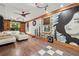 Spacious living room with wood floors, mural wall art, and modern furnishings at 2030 Spring End Ct, Lawrenceville, GA 30044