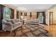 Cozy living room with hardwood floors, a patterned rug, and comfortable seating at 2030 Spring End Ct, Lawrenceville, GA 30044