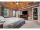 Main bedroom with wood ceiling, a neutral color scheme and carpet flooring at 2030 Spring End Ct, Lawrenceville, GA 30044